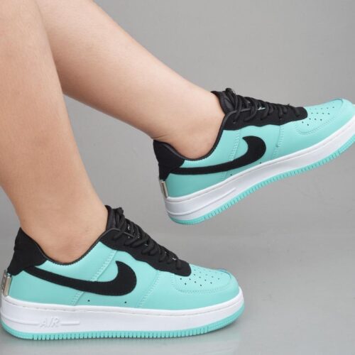 Green and black Nike shoes